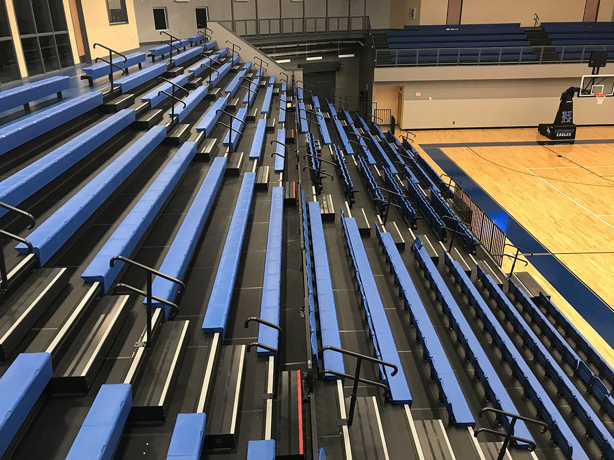 Blue Interkal EXCEL Seat Modules with ComfoBack Backrests, on a Blackout Wide Deck Premier Platform at Hennessey High School.
