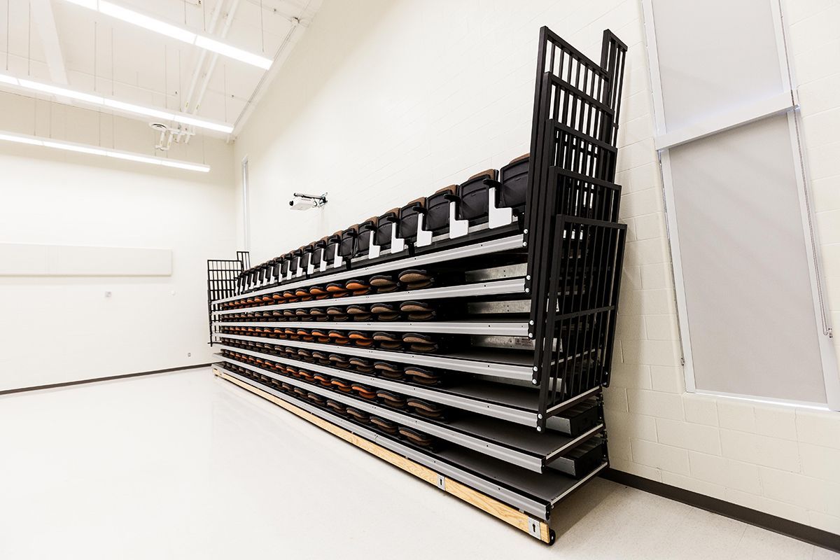 Interkal upholstered VISION Platform chairs with tablet arms on a Wide Deck Premier Platform at Cornell Secondary School.