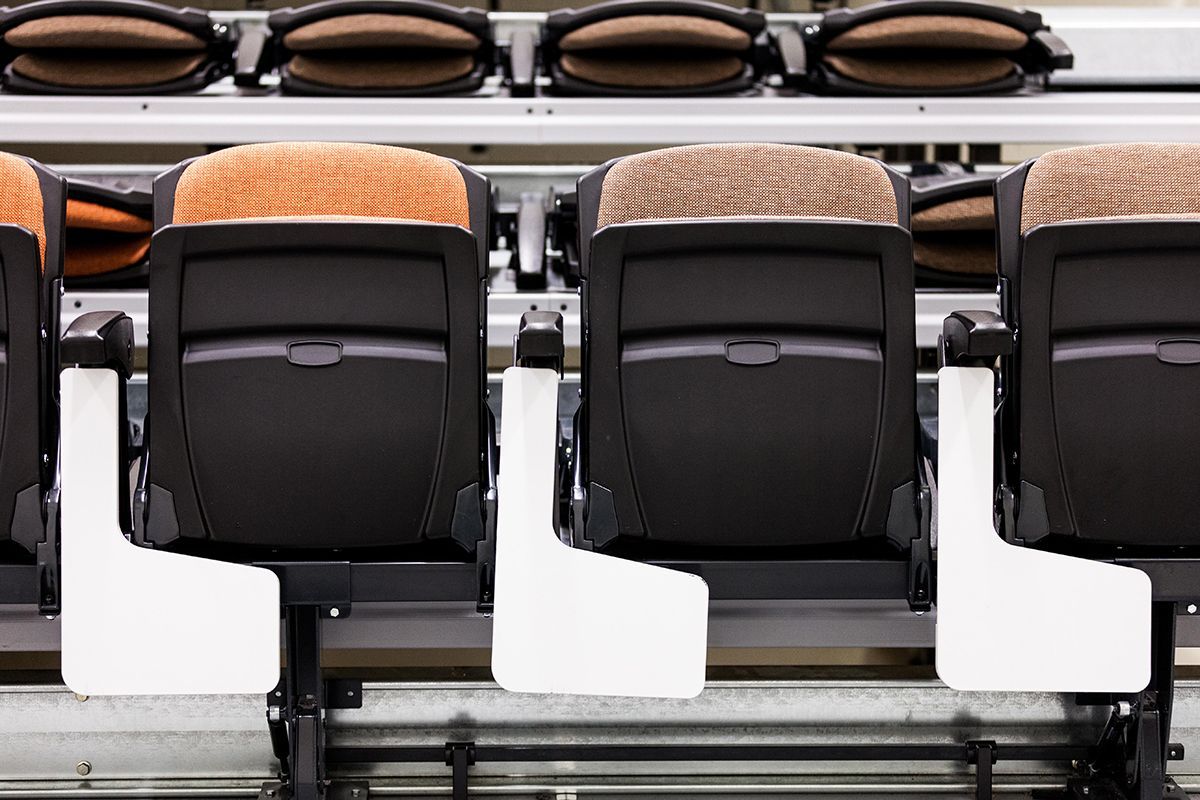 Interkal upholstered VISION Platform chairs with tablet arms on a Wide Deck Premier Platform at Cornell Secondary School.