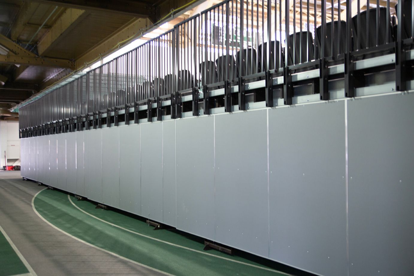 Back Panels and folding Back Rails on a wide deck premier platform telescopic system at Michigan State's Jenison Field House.