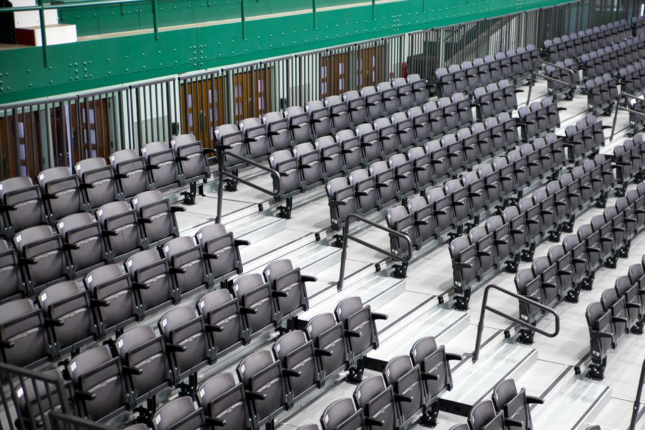 VISION Platform Chairs with armrests on a mobile Wide Deck Premier Platform system at Michigan State's Jenison Field House.
