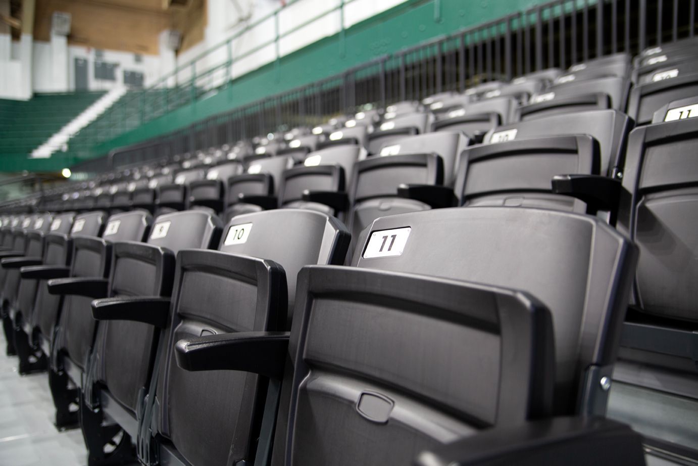VISION Platform Chairs with armrests on a mobile Wide Deck Premier Platform system at Michigan State's Jenison Field House.