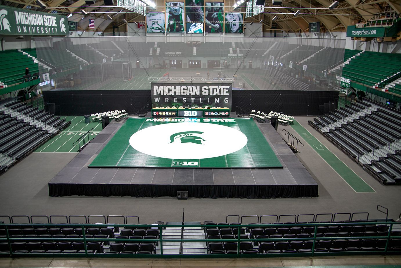 VISION Platform Chairs with armrests on a mobile Wide Deck Premier Platform system at Michigan State's Jenison Field House.