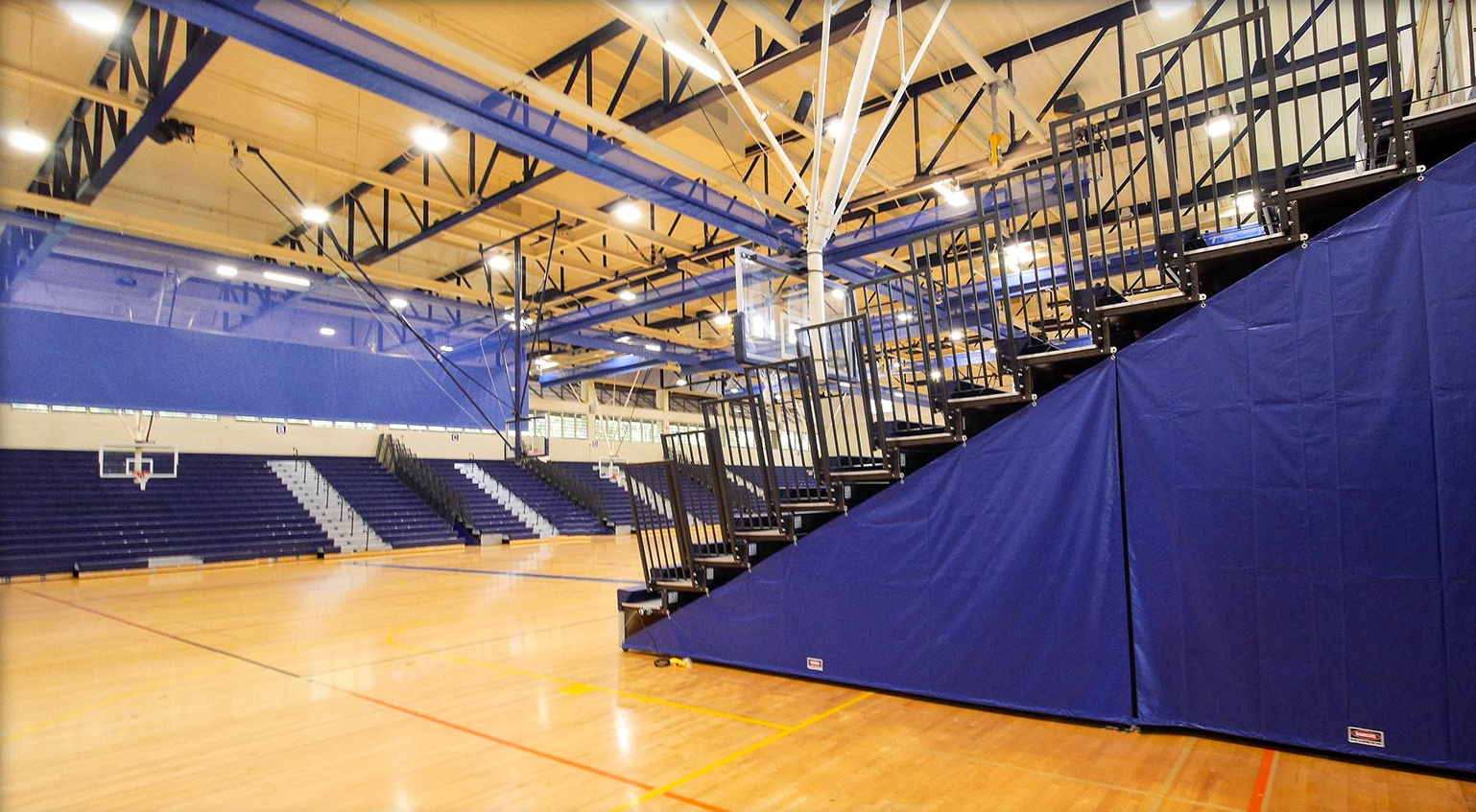 Blue Interkal EXCEL Seat Modules on a telescopic bleacher with Self-Storing Aisle Rails in Kekuhaupio, Hawaii.