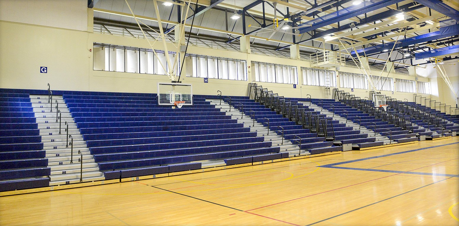 Blue Interkal EXCEL Seat Modules on a telescopic bleacher with Self-Storing Aisle Rails in Kekuhaupio, Hawaii.