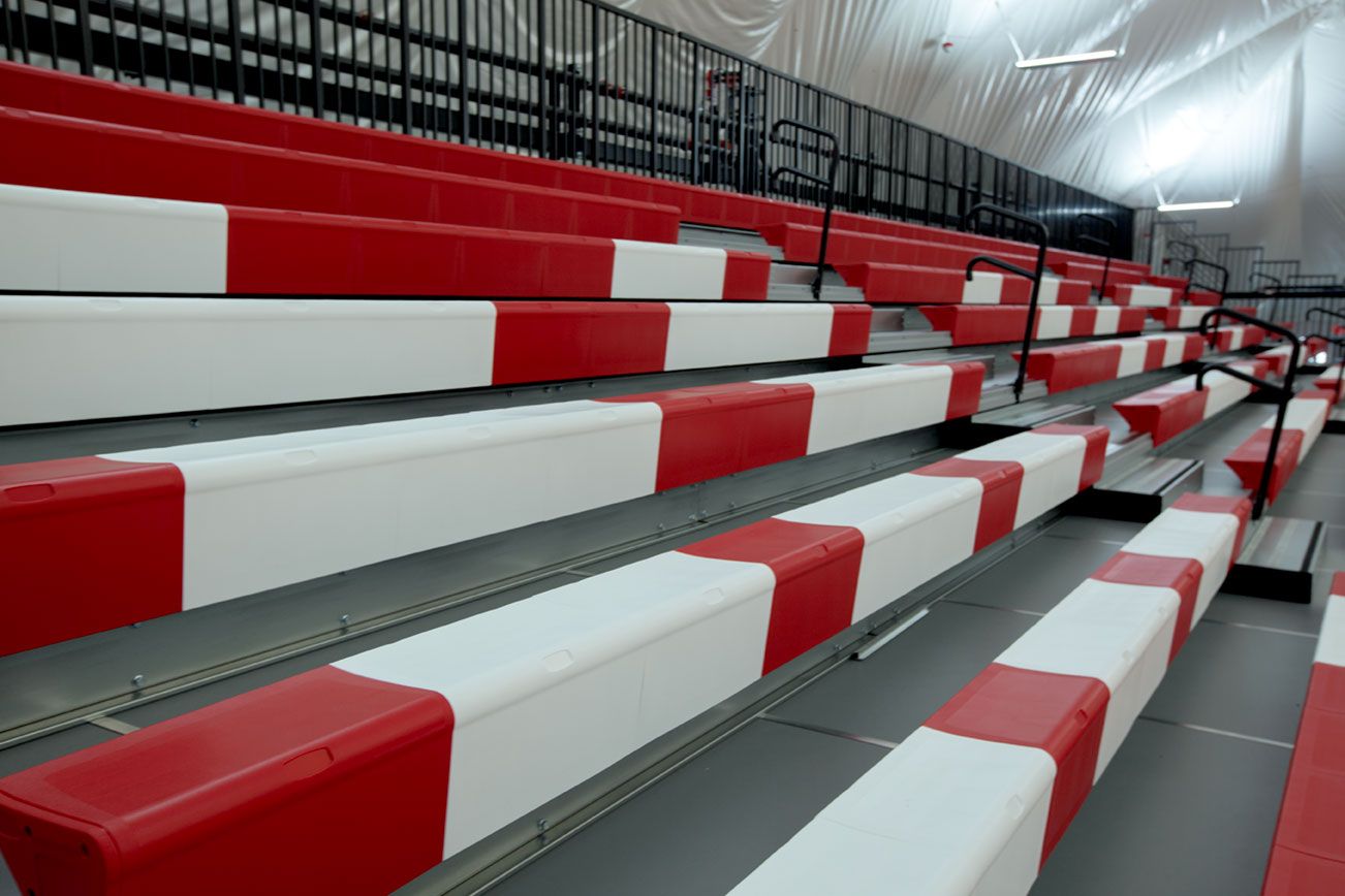 The telescopic bleacher system at the Melvindale High School dome, in Michigan, which features white school initials.