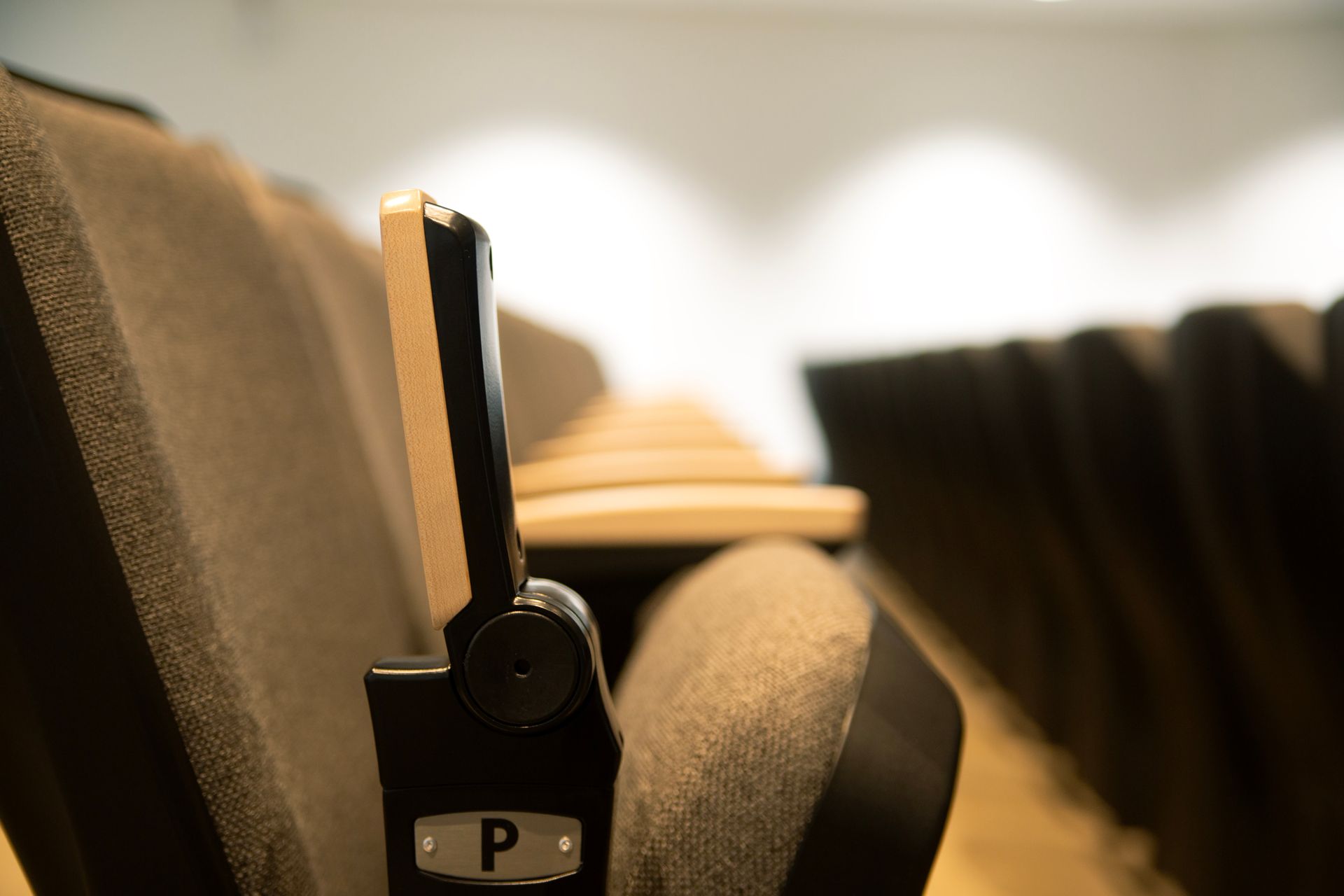 The auditorium at Montbello High School in Colorado, featuring ODYSSEY Auditorium Chairs with hardwood armrests, end panels.