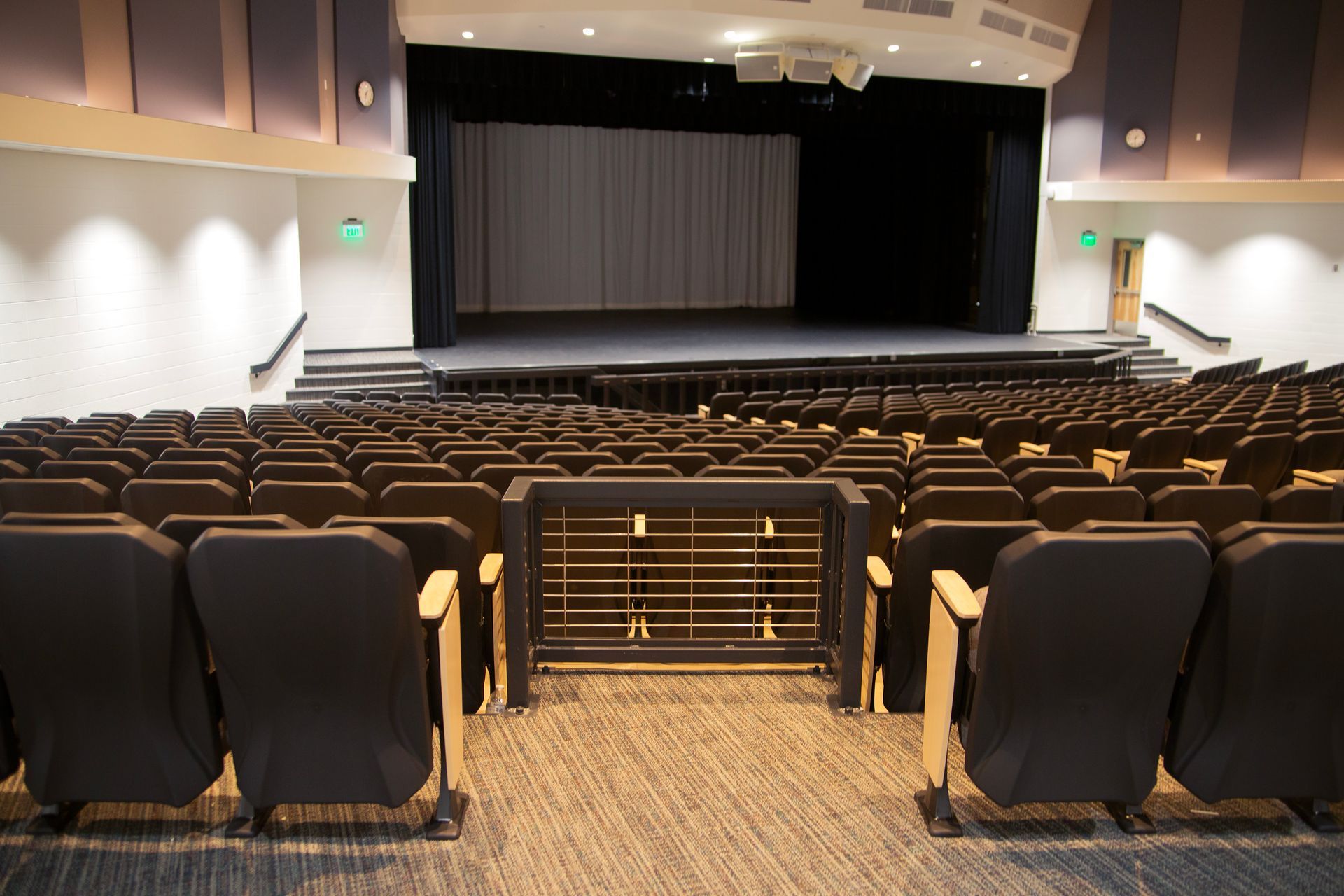 The auditorium at Montbello High School in Colorado, featuring ODYSSEY Auditorium Chairs with hardwood armrests, end panels.