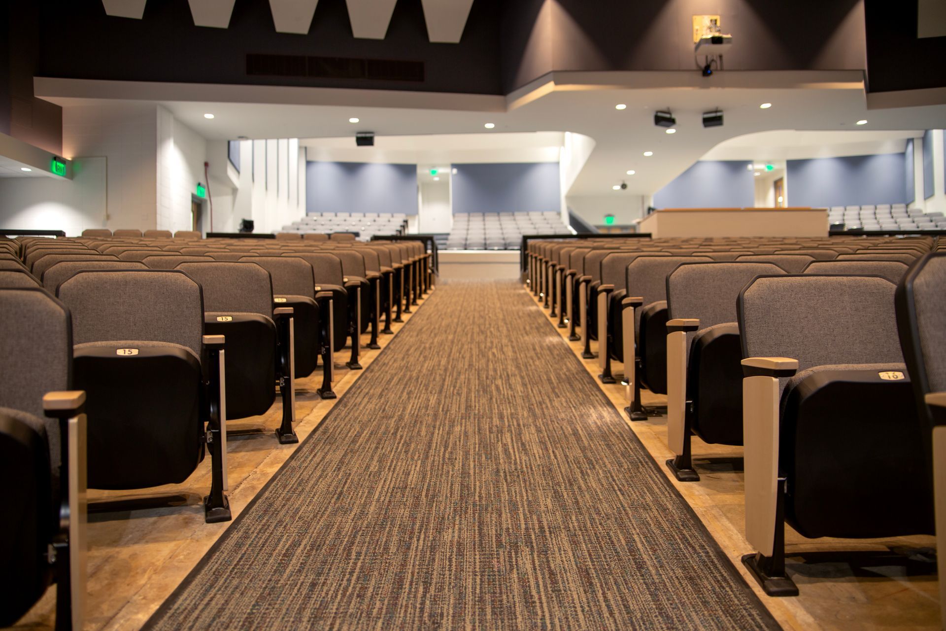 The auditorium at Montbello High School in Colorado, featuring ODYSSEY Auditorium Chairs with hardwood armrests, end panels.