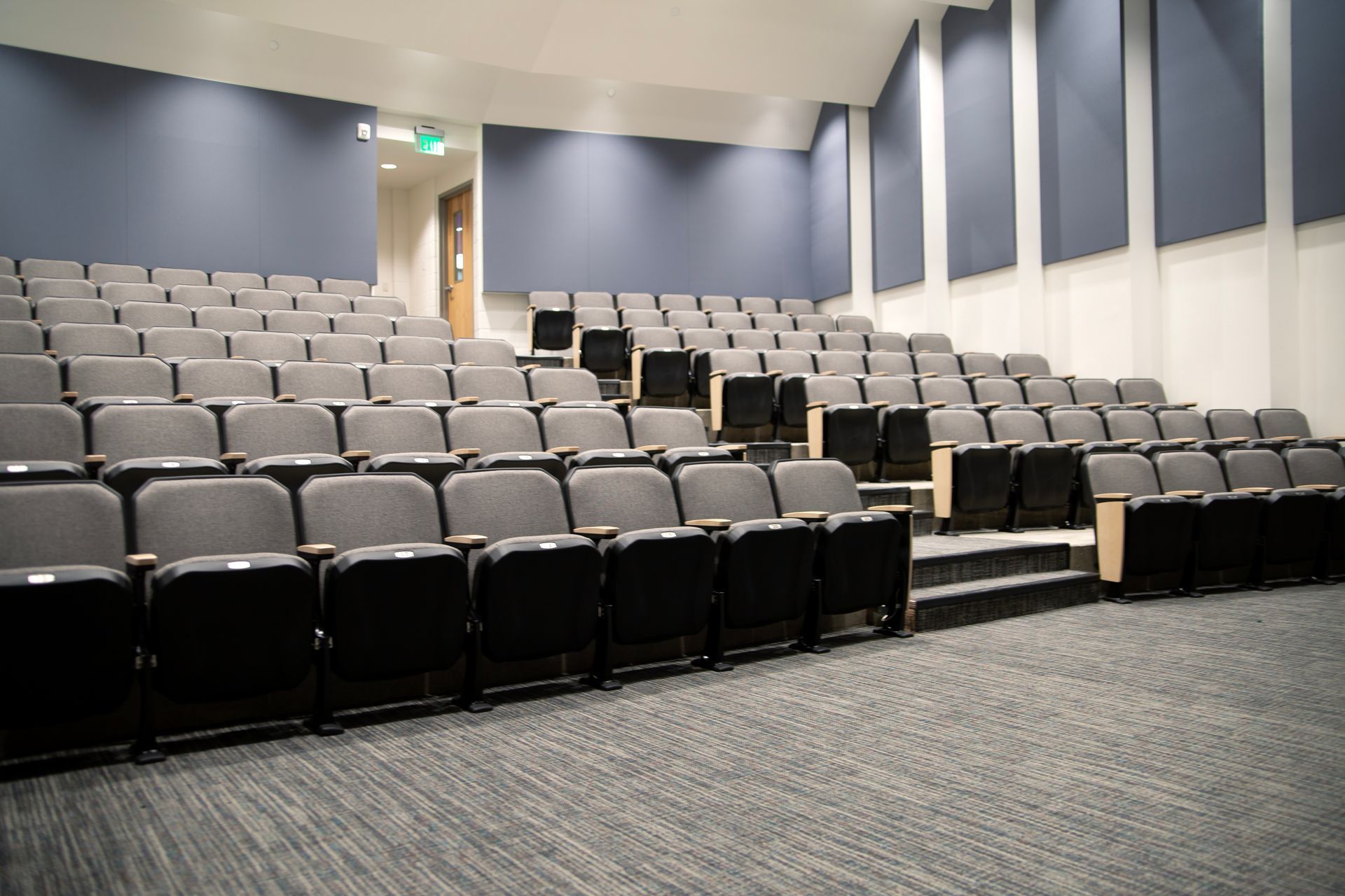 The auditorium at Montbello High School in Colorado, featuring ODYSSEY Auditorium Chairs with hardwood armrests, end panels.