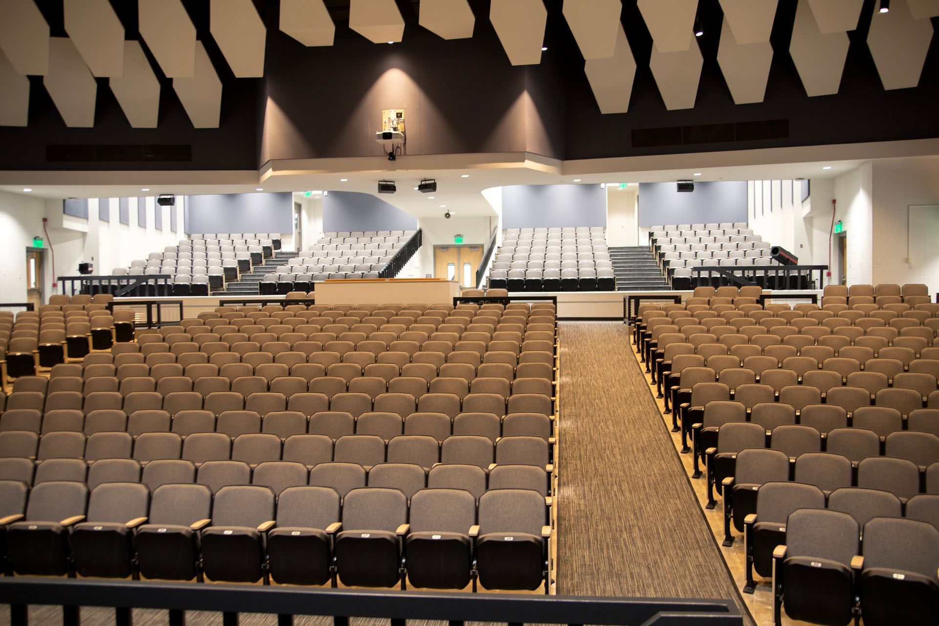 The auditorium at Montbello High School in Colorado, featuring ODYSSEY Auditorium Chairs with hardwood armrests, end panels.