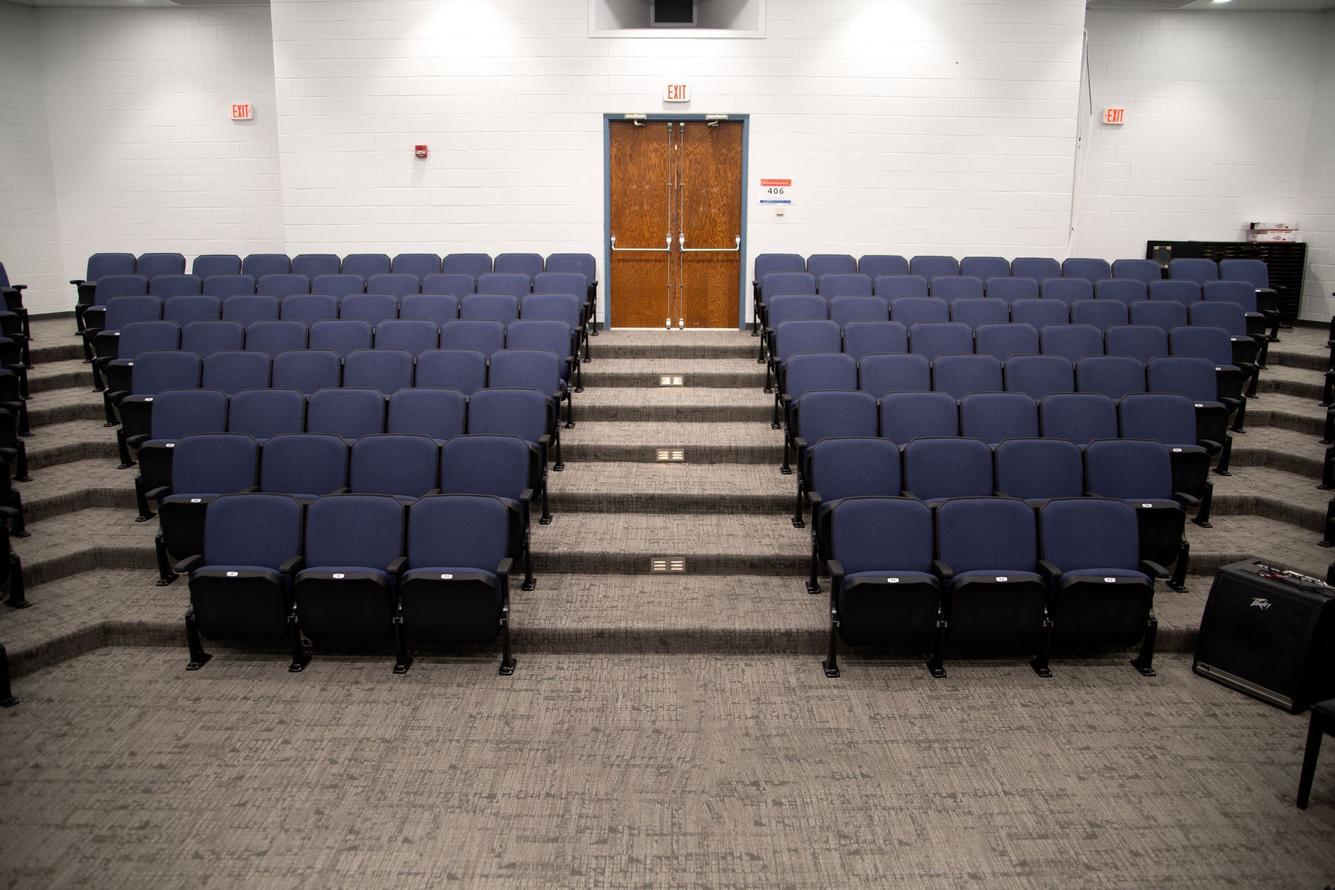 The auditorium at Sundling Junior High, with ODYSSEY Auditorium Chairs with molded armrests, blue upholstery, seat numbers.