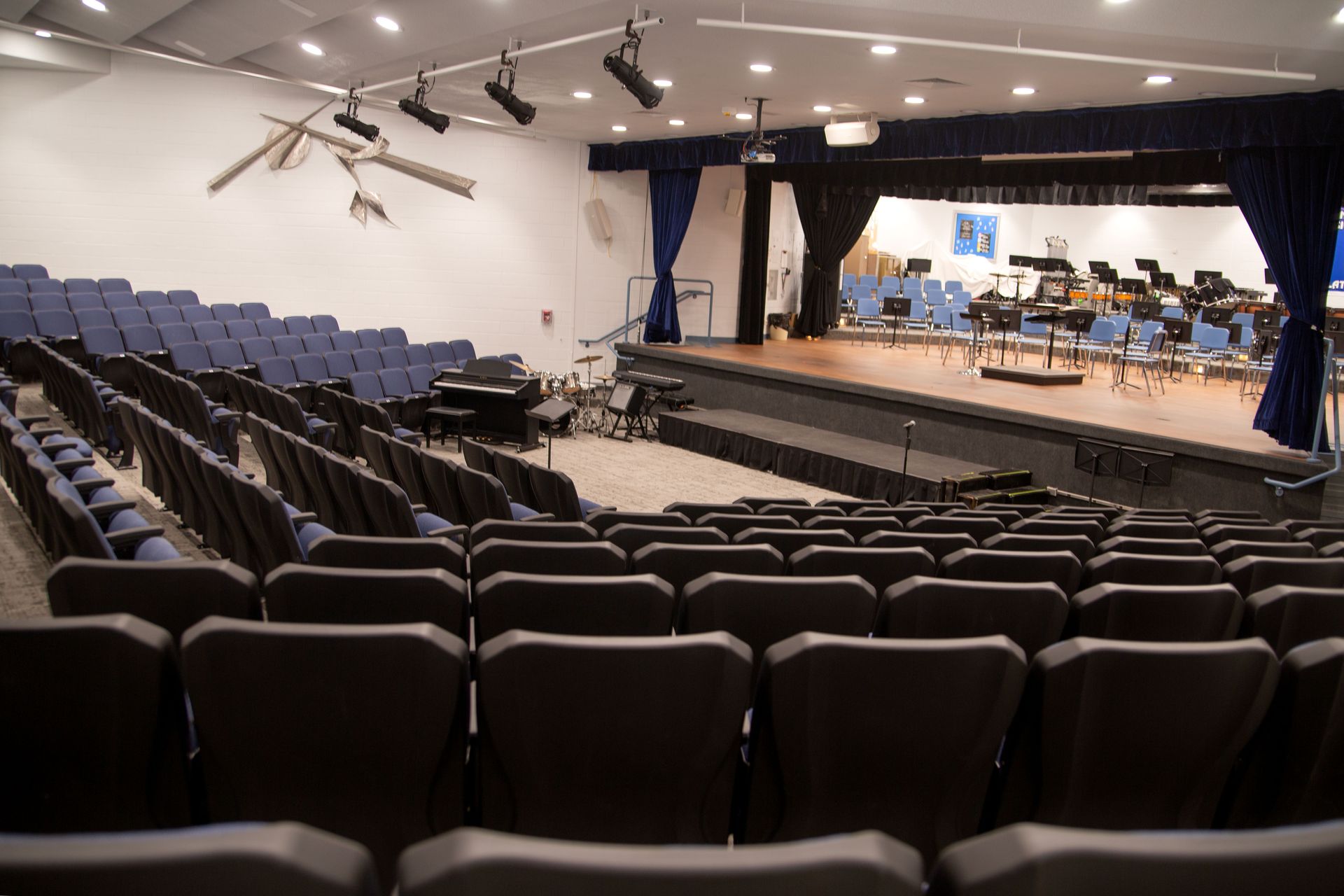 The auditorium at Sundling Junior High, with ODYSSEY Auditorium Chairs with molded armrests, blue upholstery, seat numbers.