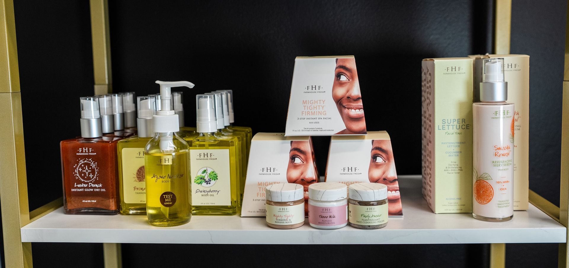 A display shelf with various skincare products including bottles, jars, and boxes.