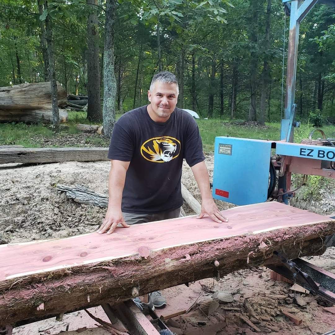 Snellen Wood Products Owner and Employee standing next to a Cedar Slab