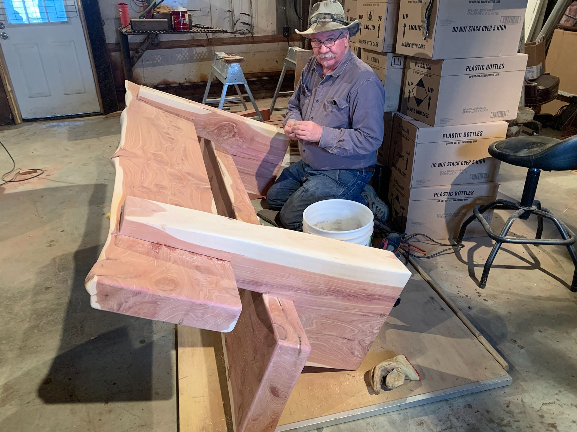 snellen wood products employee working on a cedar bench
