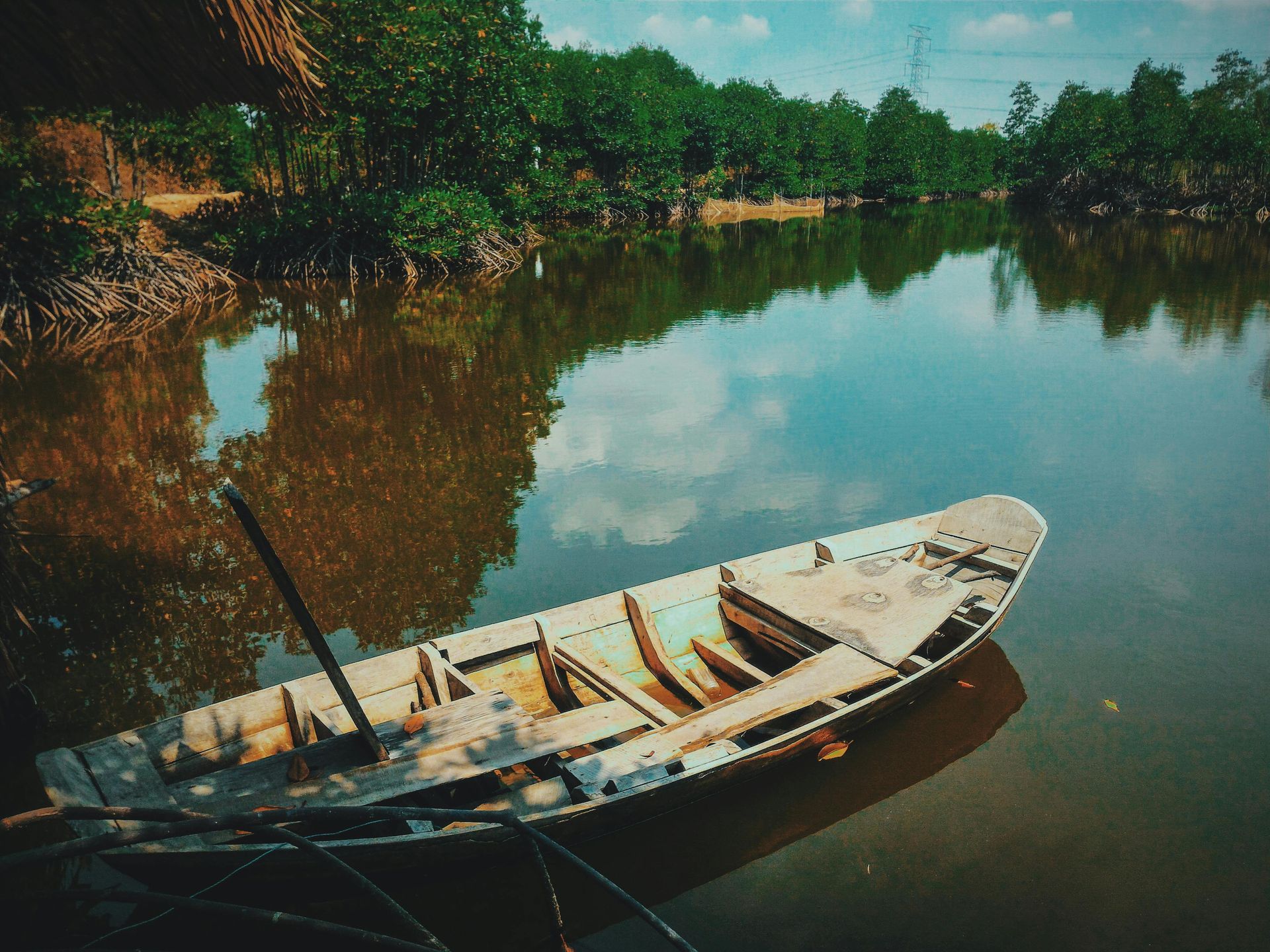 Wooden Canoe on a small body of water