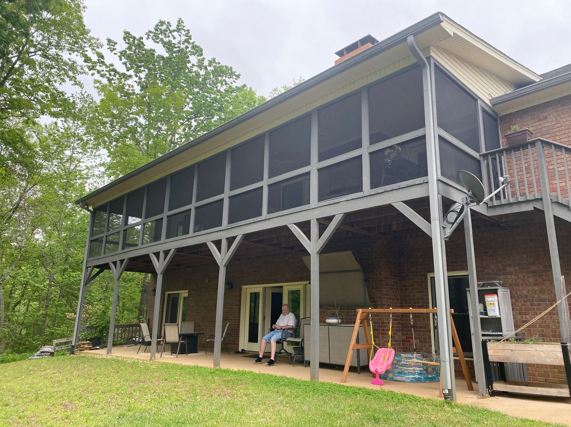 A bathroom with a toilet , sink , bathtub and shower.