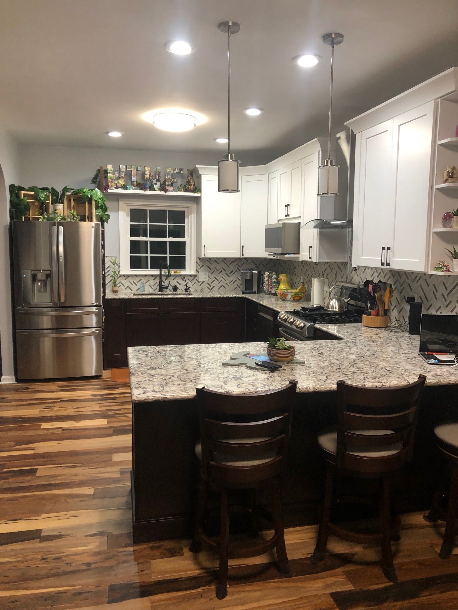 A kitchen with stainless steel appliances and granite counter tops