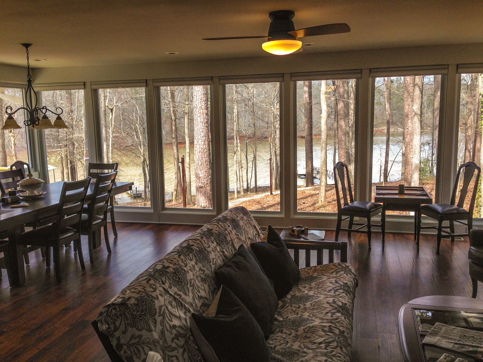 A living room with a couch and a ceiling fan