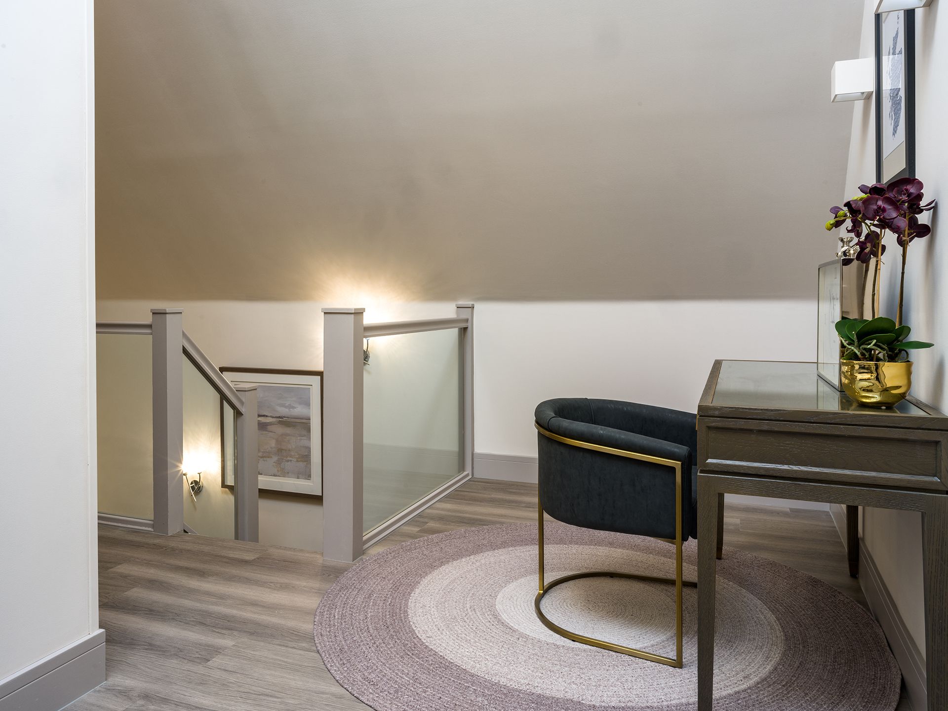 There is a chair and a desk in the room.