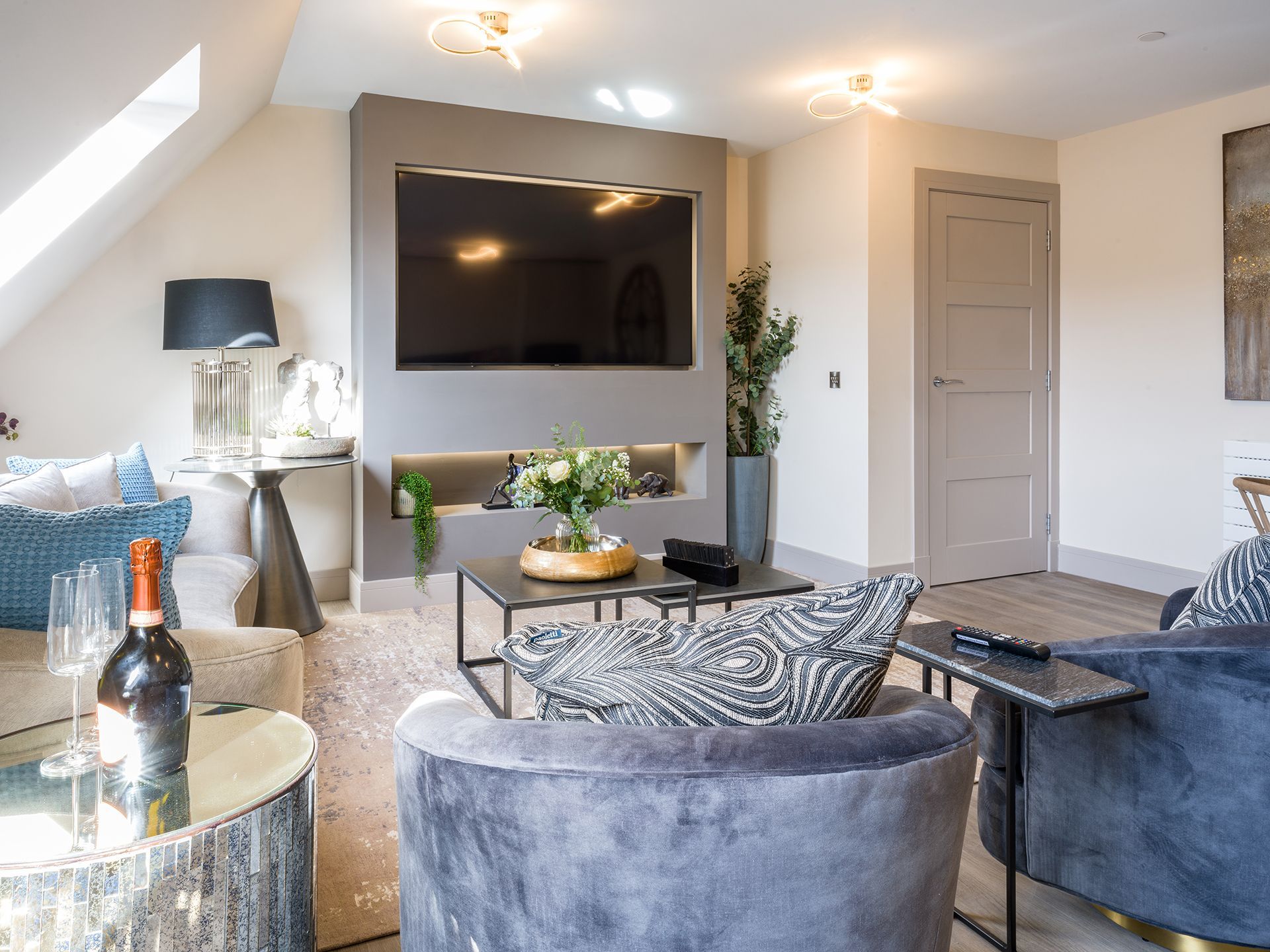 A living room filled with furniture and a flat screen tv.