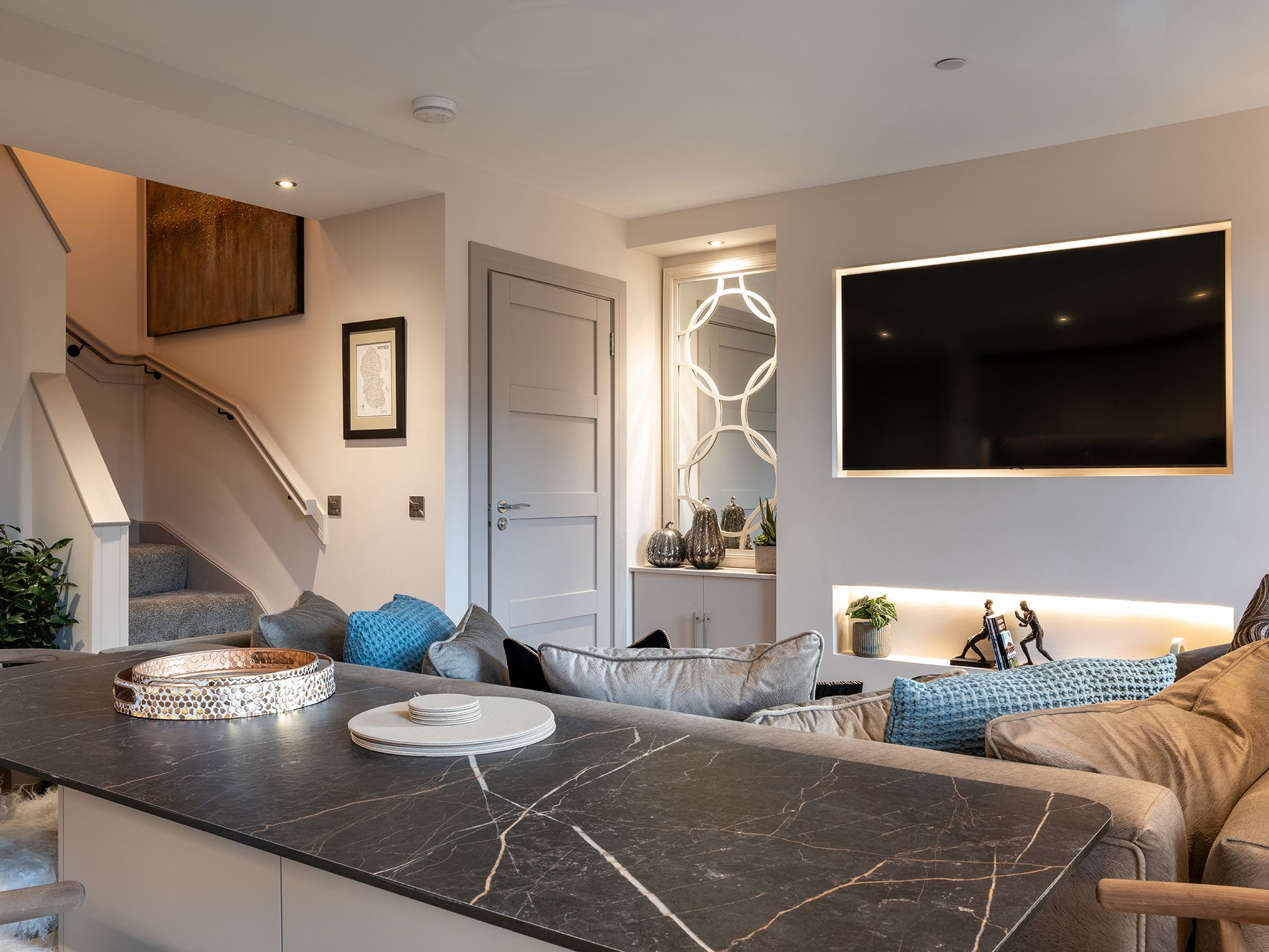 A living room with a couch and a flat screen tv