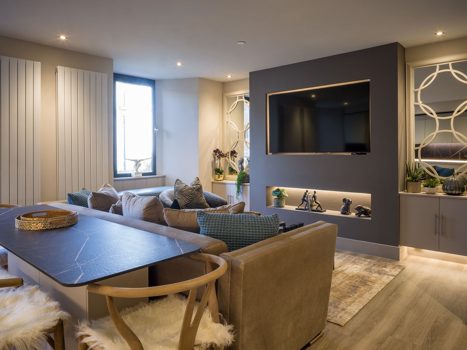 A living room with a couch , table and television.