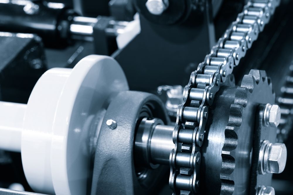 A Close Up of a Machine With a Chain and Gears — Coffs Harbour Bearing Centre in Coffs Harbour, NSW