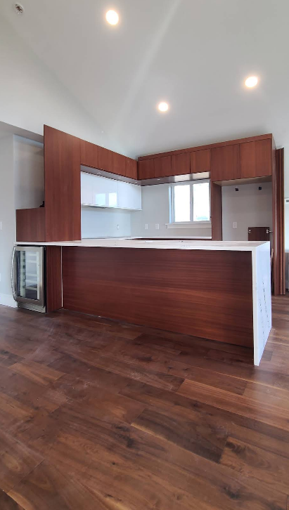 There is a large island in the middle of the kitchen.