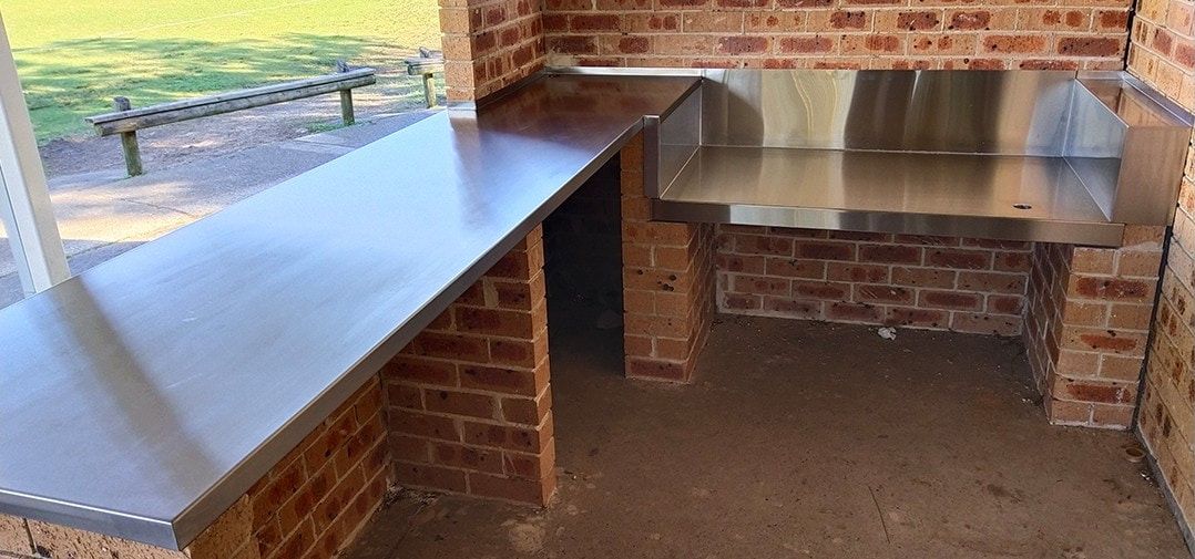Outdoor Brick Barbecue With Stainless Steel Countertops — Highlander Metals in Nowra, NSW