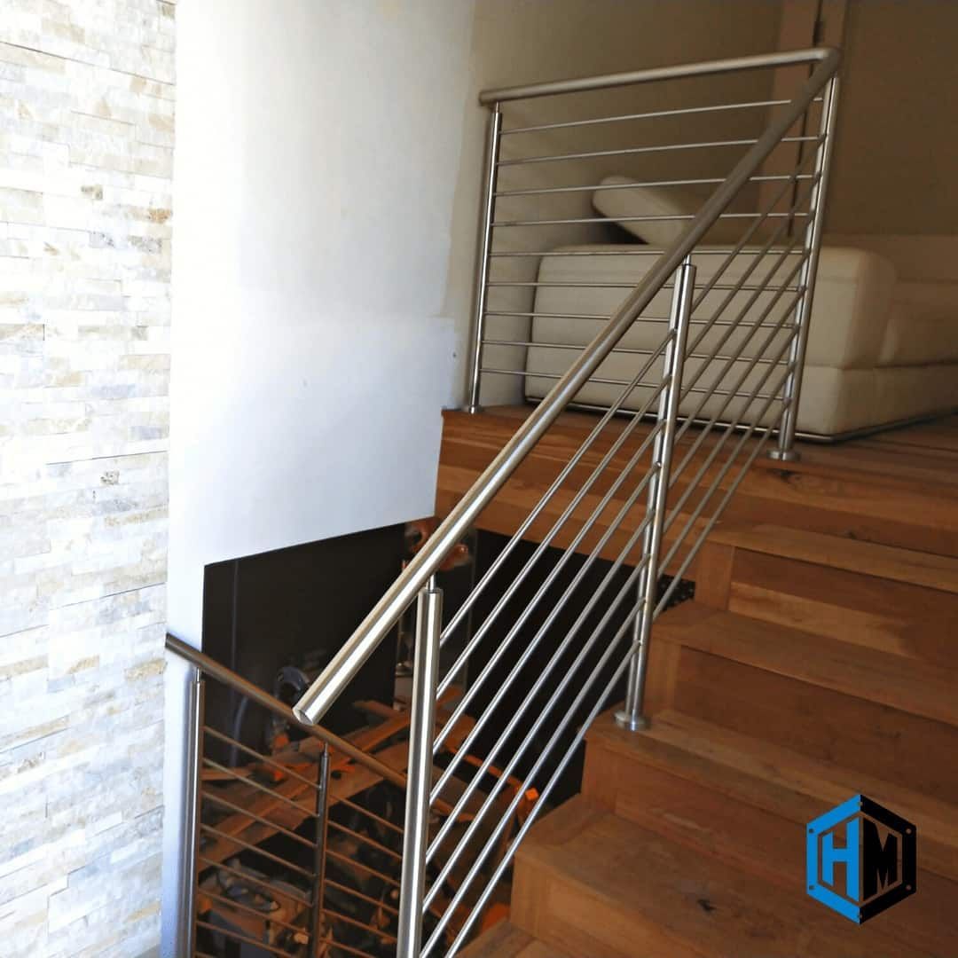 Stainless Steel Railing on Wooden Stairs. White Wall, Sofa Visible — Highlander Metals in Sutherland Shire, NSW