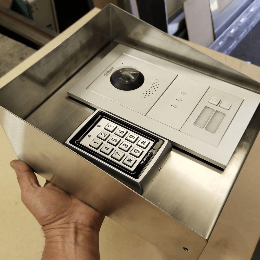 Hand Holding a Stainless Steel Box With a Security Intercom — Highlander Metals in Sutherland Shire, NSW