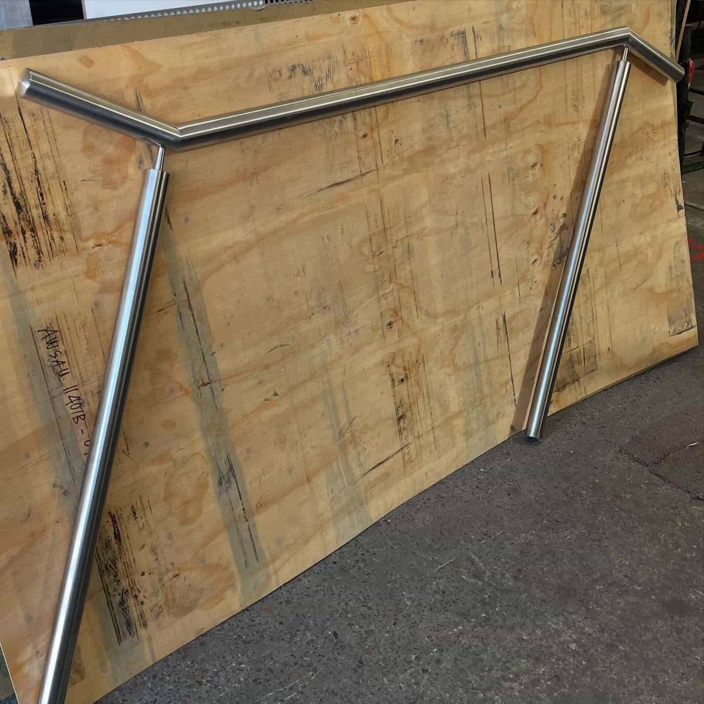 Stainless Steel Railing on a Large Wooden Surface, Likely for a Building Project — Highlander Metals in Kirrawee, NSW