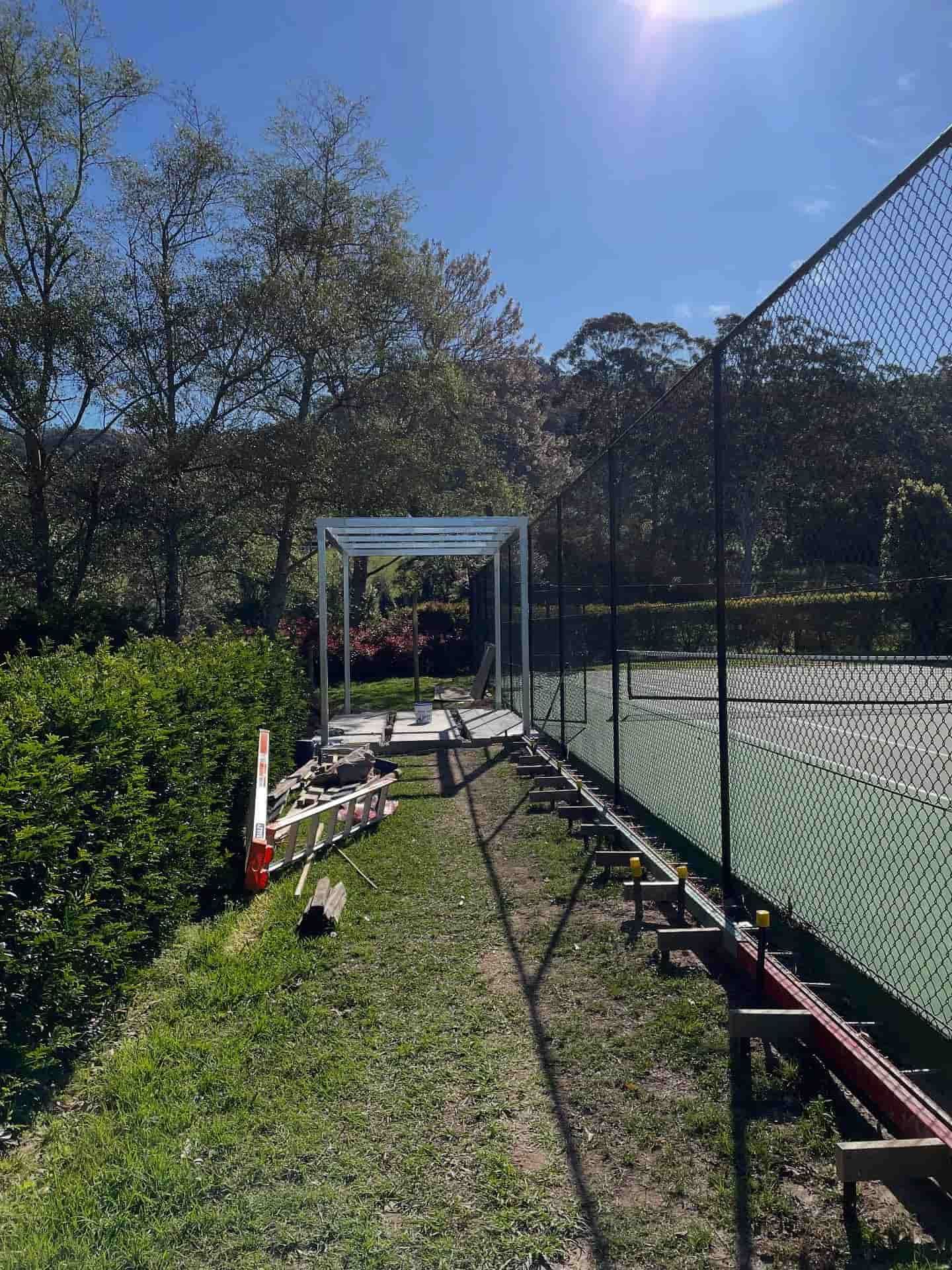 Tennis Court Under Construction With Metal Framework and Fencing — Highlander Metals in Kirrawee, NSW