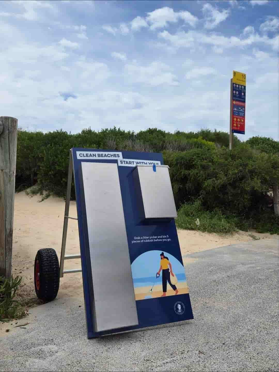 Metal Cleaning Station Sign on a Beach Path With a Grassy Dune Background — Highlander Metals in Nowra, NSW