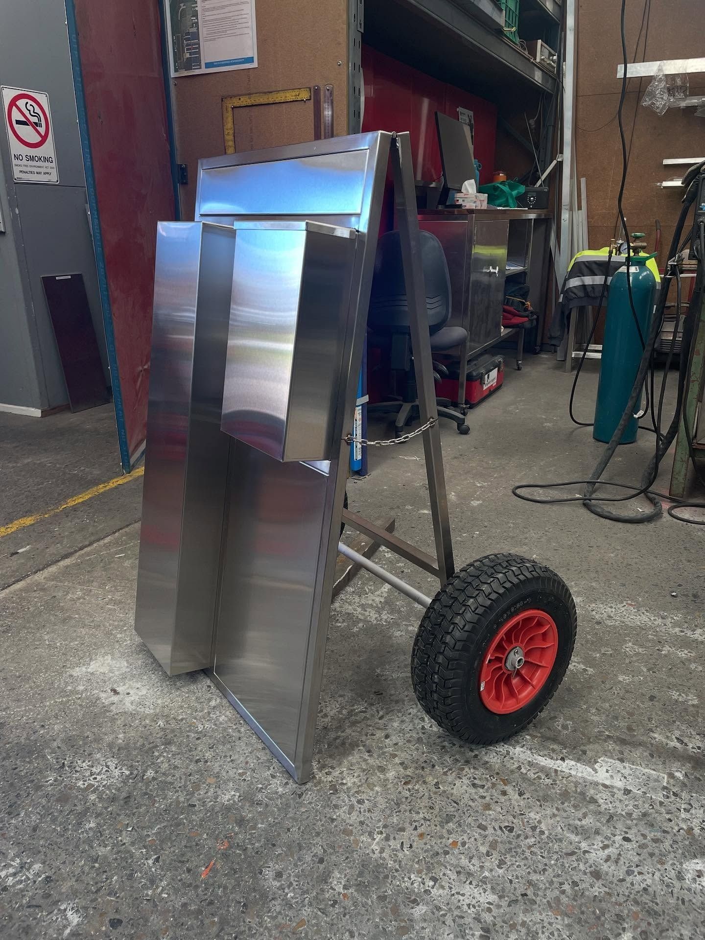 Metallic Trolley With Large Red Wheels in Sydney