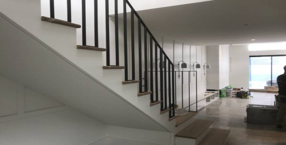 Staircase With Black Railing and White Walls — Highlander Metals in Kirrawee, NSW