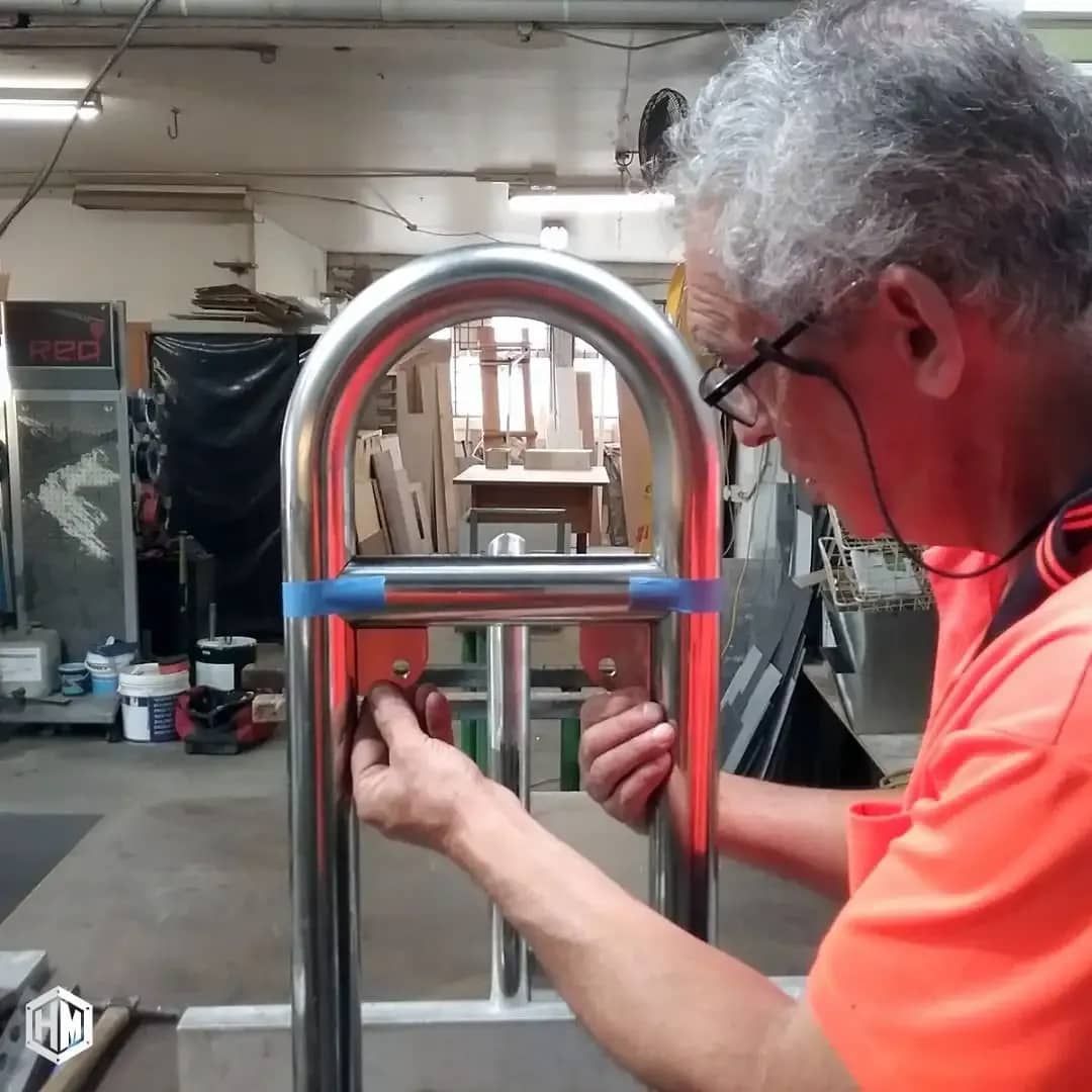 Man With Glasses Working on a Metal Frame — Highlander Metals in Nowra, NSW
