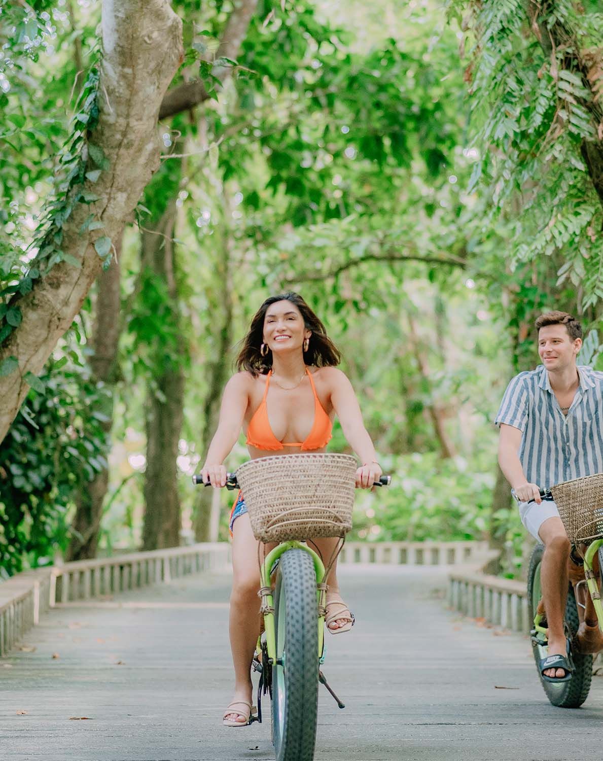 Tourist exploring lush pathway near El Nido Palawan resorts, perfect for nature lovers.