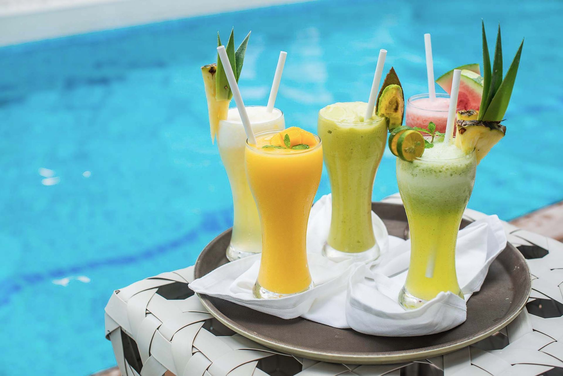 Tropical fruit smoothies by Charlie's El Nido pool, Palawan resort