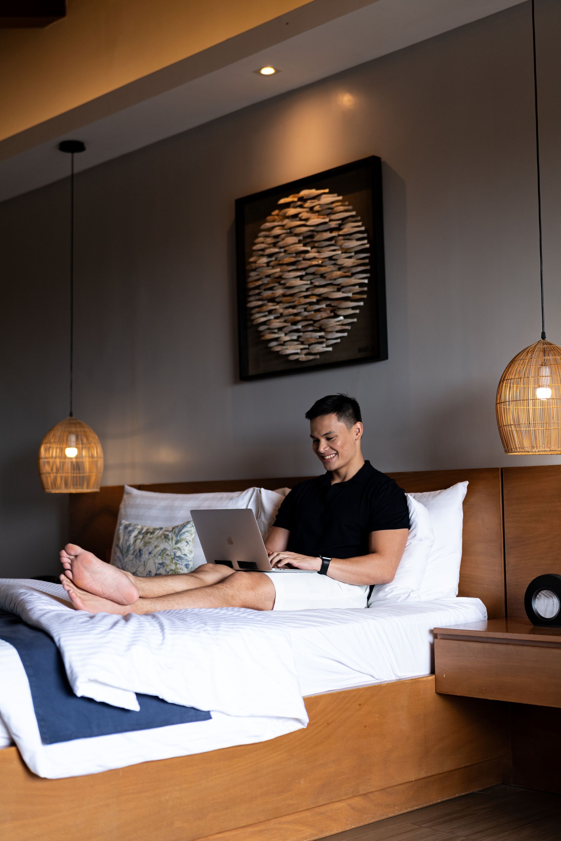 Closet with light wood doors; a white robe hangs inside.