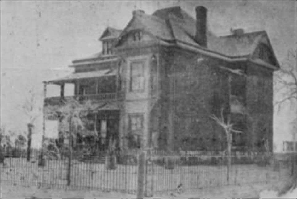 There is a four poster bed in the middle of the room.