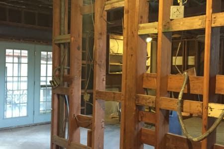 A room with a lot of wooden walls and a door.