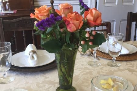 A vase filled with flowers is sitting on a table.