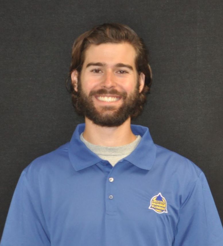 Service Plumber in Blue Collared Shirt