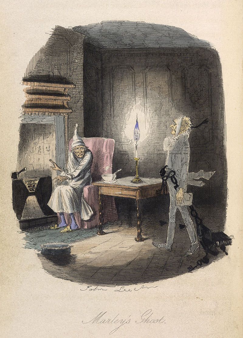 Marley's ghost: Scrooge in nightgown by fire as spectral Marley walks by. Dark room, candlelit.