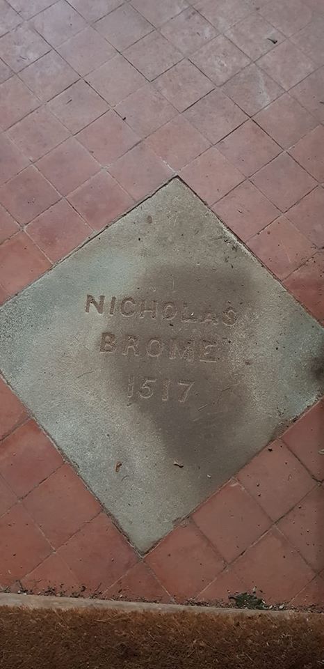 A stone floor tile inscribed 