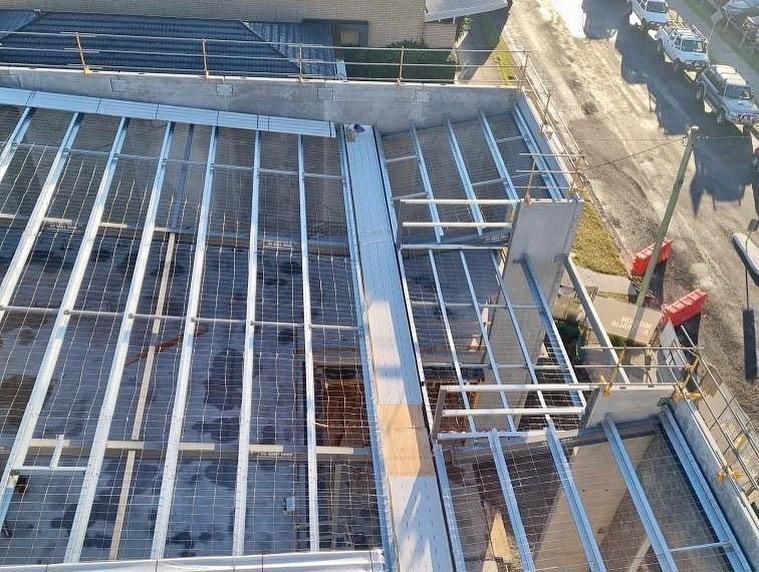 Metal Framework on a Building Rooftop Under Construction — Nambucca Plumbing in Wauchope, NSW