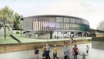 A Group of People Are Walking in Front of A Large Building — Nambucca Plumbing in Nambucca Heads, NSW